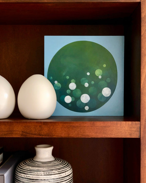 ‘Looking In’ provides a pop of color on a styled shelf. Painting by Janet Taylor Household Art.