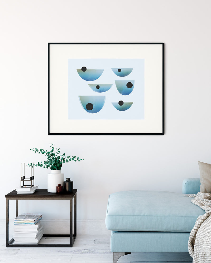 Black framed image of Drift Print by Janet Taylor | Household Art, on the wall in a light living room.