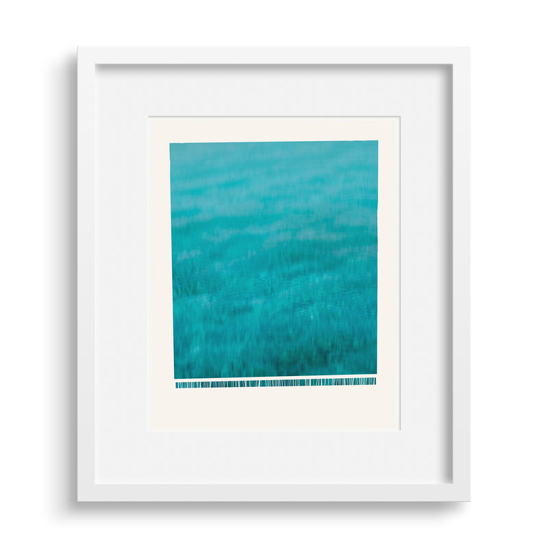 White framed version of fine art print “Wave”, A wave crashing down, frothing at the bottom, by Janet Taylor | Household Art.