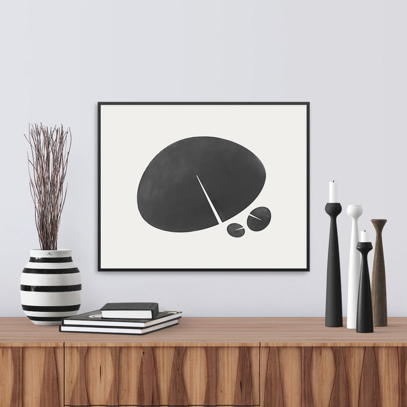 Framed view of a black and white print based on the shape of a lily leaf. Limited Edition Archival print by Janet Taylor | Household Art.